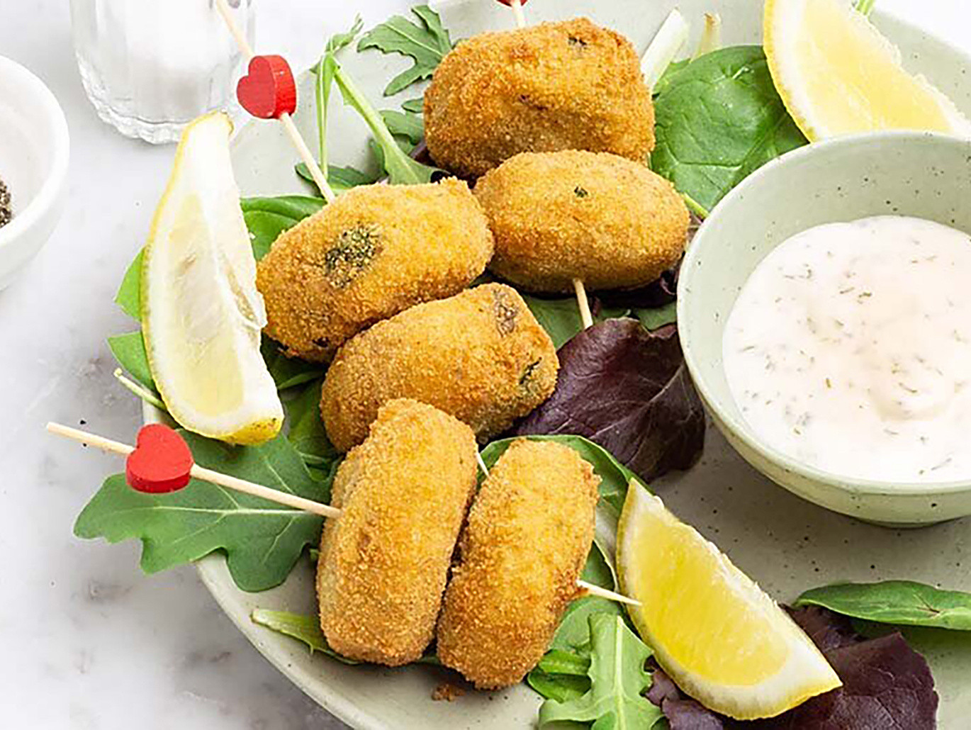 Polpette di stoccafisso norvegese con pomodori secchi e olive